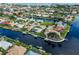 Aerial view of the community showcasing beautiful waterfront homes and canal access at 1118 Treasure Cay Ct, Punta Gorda, FL 33950