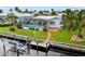 Aerial view showcasing the pool, screened lanai, private dock, and waterfront location at 1118 Treasure Cay Ct, Punta Gorda, FL 33950