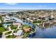 Aerial view of homes on canals, revealing boat docks, waterfront living and neighborhood layout at 1118 Treasure Cay Ct, Punta Gorda, FL 33950