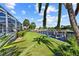 Gorgeous backyard on canal featuring lush green lawn and seawall with boat dock at 1118 Treasure Cay Ct, Punta Gorda, FL 33950