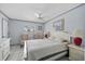 Serene bedroom featuring neutral decor, a ceiling fan, and lots of natural light at 1118 Treasure Cay Ct, Punta Gorda, FL 33950