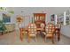 Formal dining room with wooden furniture, tile floors, and bright natural light at 1118 Treasure Cay Ct, Punta Gorda, FL 33950