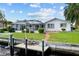 Waterfront home with screened-in lanai and boat dock along a beautiful canal at 1118 Treasure Cay Ct, Punta Gorda, FL 33950