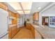 Spacious kitchen featuring wooden cabinets, granite countertops, and modern appliances at 1118 Treasure Cay Ct, Punta Gorda, FL 33950