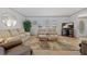 Inviting living room featuring neutral furniture, tiled floors, and lots of natural light at 1118 Treasure Cay Ct, Punta Gorda, FL 33950