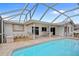 Refreshing backyard pool area with pool-side furniture, with an inviting patio at 1118 Treasure Cay Ct, Punta Gorda, FL 33950