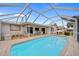 Beautiful screened-in pool with ample patio space and outdoor seating at 1118 Treasure Cay Ct, Punta Gorda, FL 33950