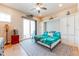 Bedroom featuring a Murphy bed, ceiling fan, and access to the patio at 11723 1St E St, Treasure Island, FL 33706