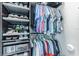 Well-organized closet featuring hanging clothes and storage racks for shoes at 11723 1St E St, Treasure Island, FL 33706