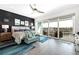 Main bedroom suite features a private balcony with water views and modern decor, offering a serene retreat at 11723 1St E St, Treasure Island, FL 33706