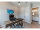 Stylish office space features a wooden desk, ergonomic chair, and adjacent bathroom for added convenience at 11723 1St E St, Treasure Island, FL 33706