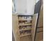 Pantry shelves with roll out storage drawers in a modern kitchen at 11723 1St E St, Treasure Island, FL 33706