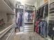 Spacious walk-in closet with custom shelving, drawers, and ample hanging space for organized storage at 11723 1St E St, Treasure Island, FL 33706