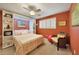 Cozy bedroom with a ceiling fan, window, and a bed with built-in shelving at 1200 Winward Ct, Punta Gorda, FL 33950
