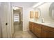 Bathroom featuring double sink vanity, tile flooring, and linen closet at 127 Compton St, Port Charlotte, FL 33954