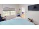 Relaxing bedroom with window and view of the dining area at 1286 Green Oak Trl, Port Charlotte, FL 33948