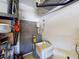 Garage with utility sink, water heater, shelving and storage at 1286 Green Oak Trl, Port Charlotte, FL 33948