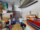 Garage with shelving, storage, utility sink and water heater at 1286 Green Oak Trl, Port Charlotte, FL 33948