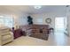 Spacious living room featuring tile floors, a large sectional sofa, and ample natural light from windows at 1286 Green Oak Trl, Port Charlotte, FL 33948