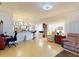 Open-concept living space with breakfast bar, accent lighting, and a view of the dining area at 1286 Green Oak Trl, Port Charlotte, FL 33948