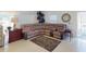 Comfortable living room with a plush sectional sofa, tile flooring, and a cozy rug at 1286 Green Oak Trl, Port Charlotte, FL 33948