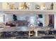 Open concept living space with comfortable seating and view from kitchen bar at 1286 Green Oak Trl, Port Charlotte, FL 33948