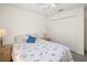 Cozy bedroom with neutral carpet, ceiling fan, and closet for storage at 1364 Ultramarine Ln, Punta Gorda, FL 33983