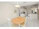 Cozy dining area with tile flooring and an adjacent open kitchen space at 1364 Ultramarine Ln, Punta Gorda, FL 33983