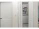 A conveniently located laundry closet with stacked washer and dryer for space-saving efficiency at 1364 Ultramarine Ln, Punta Gorda, FL 33983