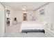 Spacious main bedroom featuring plush carpet, adjacent living spaces, and neutral walls at 1364 Ultramarine Ln, Punta Gorda, FL 33983