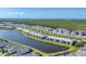 Expansive aerial view of the community, showcasing waterfront properties at 14184 Heritage Landing Blvd # 516, Punta Gorda, FL 33955