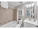 Well-lit bathroom with shower-tub combo, large mirror, and tiled shower at 14184 Heritage Landing Blvd # 516, Punta Gorda, FL 33955