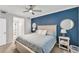 Comfortable bedroom with an accent wall, bedside tables, and plentiful natural light for a relaxing atmosphere at 14184 Heritage Landing Blvd # 516, Punta Gorda, FL 33955