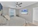 Serene bedroom featuring a plush bed, modern ceiling fan, and a TV for relaxed viewing at 14184 Heritage Landing Blvd # 516, Punta Gorda, FL 33955