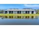 Scenic exterior shot of the property featuring a tranquil lake view at 14184 Heritage Landing Blvd # 516, Punta Gorda, FL 33955
