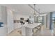 Modern kitchen featuring a large center island with seating, stainless steel appliances, and ample storage at 14184 Heritage Landing Blvd # 516, Punta Gorda, FL 33955