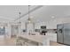Bright kitchen featuring stainless steel appliances, a large island, and ample counter space at 14184 Heritage Landing Blvd # 516, Punta Gorda, FL 33955