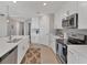 Modern kitchen with stainless steel appliances, white cabinets, and quartz countertops, great for entertaining at 14184 Heritage Landing Blvd # 516, Punta Gorda, FL 33955