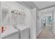 Convenient laundry room with washer, dryer, and shelving at 14184 Heritage Landing Blvd # 516, Punta Gorda, FL 33955