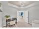 Home office space with an open doorway leading to a serene living area, promoting work-life balance at 14184 Heritage Landing Blvd # 516, Punta Gorda, FL 33955