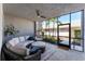 Relaxing screened-in patio with comfortable seating, a ceiling fan, and lovely outdoor views at 14184 Heritage Landing Blvd # 516, Punta Gorda, FL 33955