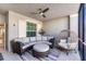 Relaxing screened-in patio with comfortable seating, ceiling fan, and natural light at 14184 Heritage Landing Blvd # 516, Punta Gorda, FL 33955