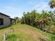 Private backyard with lake and lush vegetation at 1790 New London St, North Port, FL 34288