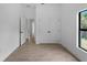 Bright bedroom featuring tile flooring, closet space, and a window with natural light at 1790 New London St, North Port, FL 34288