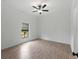 Bedroom with tile floors and a backyard view from the window at 1790 New London St, North Port, FL 34288