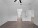 Bright bedroom with neutral tile flooring, a ceiling fan, and easy access to other rooms at 1790 New London St, North Port, FL 34288