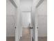Walk-in closets with ample storage space, wire shelving, and neutral tile flooring at 1790 New London St, North Port, FL 34288