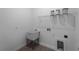 Practical laundry room features a utility sink, shelving and tile flooring at 1790 New London St, North Port, FL 34288