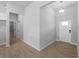 Inviting entryway showcases a white front door and tiled floors, leading into the home at 1818 New London St, North Port, FL 34288