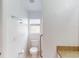 Bathroom featuring a toilet, grab bars and a window that provides natural light at 20370 Mount Prospect Ave, Port Charlotte, FL 33952